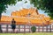 Tourist man with backpack looking the marble temple during a travel in Bangkok, Thailand. Backpacker in travel concept