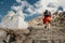 Tourist man climbs up stairs to tibetan holy place in Himalaya m