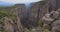 Tourist man on the edge of the mountain cliff of Tazi Canyon in Manavgat, Antalya, Turkey. Greyhound Canyon, Wisdom