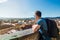 Tourist man looking to a beautiful view of the city Ljubljana