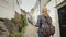 Tourist with a map in her hands walking through the narrow streets of Bergen in Norway. Holidays in Scandinavia