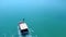 Tourist motorboat sailing on blue tranquil sea. Aerial view
