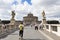 Tourist passing St. Angelo Bridge and Sant Angelo Castle