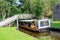 Tourist people cruise boat trip canal, Giethoorn, Netherlands