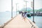 Tourist people or traveler walk on the bridge for Boat go to Koh Kam island or Samaesarn island at Sattahip Chonburi, Thailand.