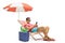 Tourist with a phone sitting in a deck chair with an umbrella ne
