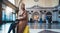 Tourist photographer woman with suitcase on platform station in Barcelona. Girl traveler waiting train enjoy holiday weekend