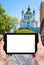 tourist photographs St Andrew\'s Church in Kiev