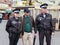 Tourist posing with police officers of the Romanian Police in Medias, in Central Transylvania