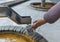 Tourist pours mineral water from the source in Karlovy Vary - Cz