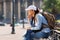 Tourist resting on bench