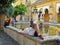Tourist resting, Patio de los Naranjos at Mosque in Cordoba, Spain