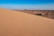 Tourist safari vehicle seen from North Horr Sand dunes in Marsabit County, Kenya