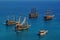 Tourist sailboats in turquoise waters of the Mediterranean sea beside the Turkish ancient fortress Alanya. Antalya