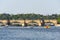 Tourist sailing on pedal boats on Vltava river near Charles bridge in Prague, Czech Republic