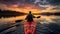 Tourist sails kayak along calm lake at gentle sunrise light discovering wild nature