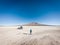 Tourist in the salt flat Uyuni