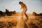 Tourist Sandboarding In the Desert Man jumps in and does the trick