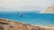 Tourist schooner anchored in Aegean bay near Mykonos island.