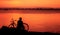 A tourist seated on a rock of the dam of Parakrama samudraya lake in Polonnaruwa in Sri Lanka.