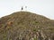 Tourist on sharp basalt peak of volcano formation