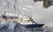 Tourist ship on the background of mountains and glaciers of the