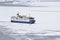 tourist ship breaking ice in the strait of the Antarctic Peninsula