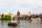 Tourist the ship floats under Charles bridge