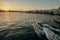 Tourist ship sails on the Golden Horn, scenic sunny beautiful waterfront  of Istanbul city at sunset in summer