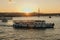 Tourist ship sails on the Golden Horn, scenic sunny beautiful waterfront  of Istanbul city at sunset in summer