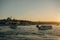 Tourist ship sails on the Golden Horn, scenic sunny beautiful waterfront  of Istanbul city at sunset in summer