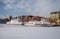 Tourist ships mooring in ice during winter in Old Town of Gdansk Poland. Old town in the background.