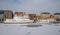 Tourist ships mooring in ice during winter in Old Town of Gdansk Poland. Old town in the background.