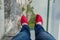 Tourist in shoe covers on glass pathway in Tianmenshan nature pa