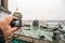 Tourist shoots video on action camera roof of St. Isaac`s Cathedral in St. Petersburg