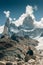 tourist sits on the background of the mountains of Fitz Roy in Argentina