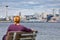 Tourist Sitting on Bench Looking At The Seattle, Washington Skyline