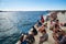 Tourist sitting on Sea Organ, Zadar