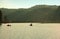 Tourist sitting and standing on the bamboo raft floating in clear water in the morning at Pang Oung Lake (Pang Tong reservoir), M