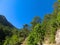 Tourist sliding on a zip line in the canyon of Harmony, near the town of Goynuk and Antalya