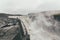 Tourist standing on extremely dangerous distance near Dettifoss waterfall in VatnajÃ¶kull National Park in Northeast Iceland