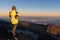 Tourist standing on top of Rinjani mountain and enjoy volcano sunrise view