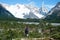 tourist stands on the background of the mountains of Fitz Roy in Argentina