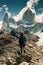 tourist stands on the background of the mountains of Fitz Roy in Argentina