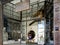 Tourist Stands at Entrance of Gentrified Historical Building in Arts District of Downtown Los Angeles