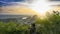 Tourist staying on the top of mountain and taking a photos of Marble mountains