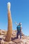 Tourist surprised by the large size of the cactus in the island of Incahuasi, Uyuni salt flat, Bolivia