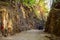 Tourist SUV car cruising along a rugged route through the gorge that was once a former railway line built by prisoners of war