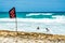 Tourist swim under No Swimming Red Flag