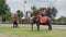 Tourist take an elephant ride to see ancient temples at Ayutthaya Historical Park with a new